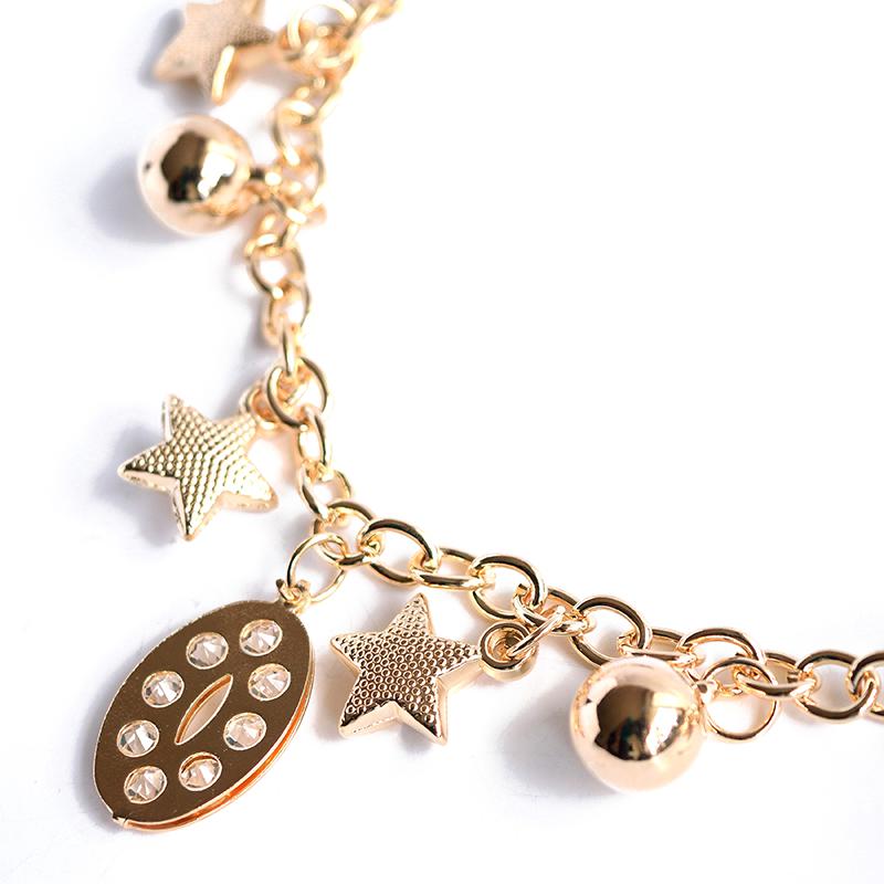 star and moon charm bracelet close up